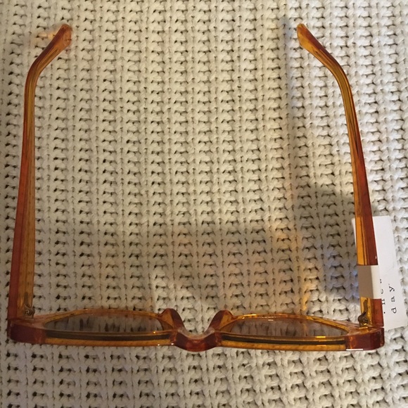 Women’s Shiny Plastic Unique Shape Sunglasses - a new day light orange - Picture 2 of 5